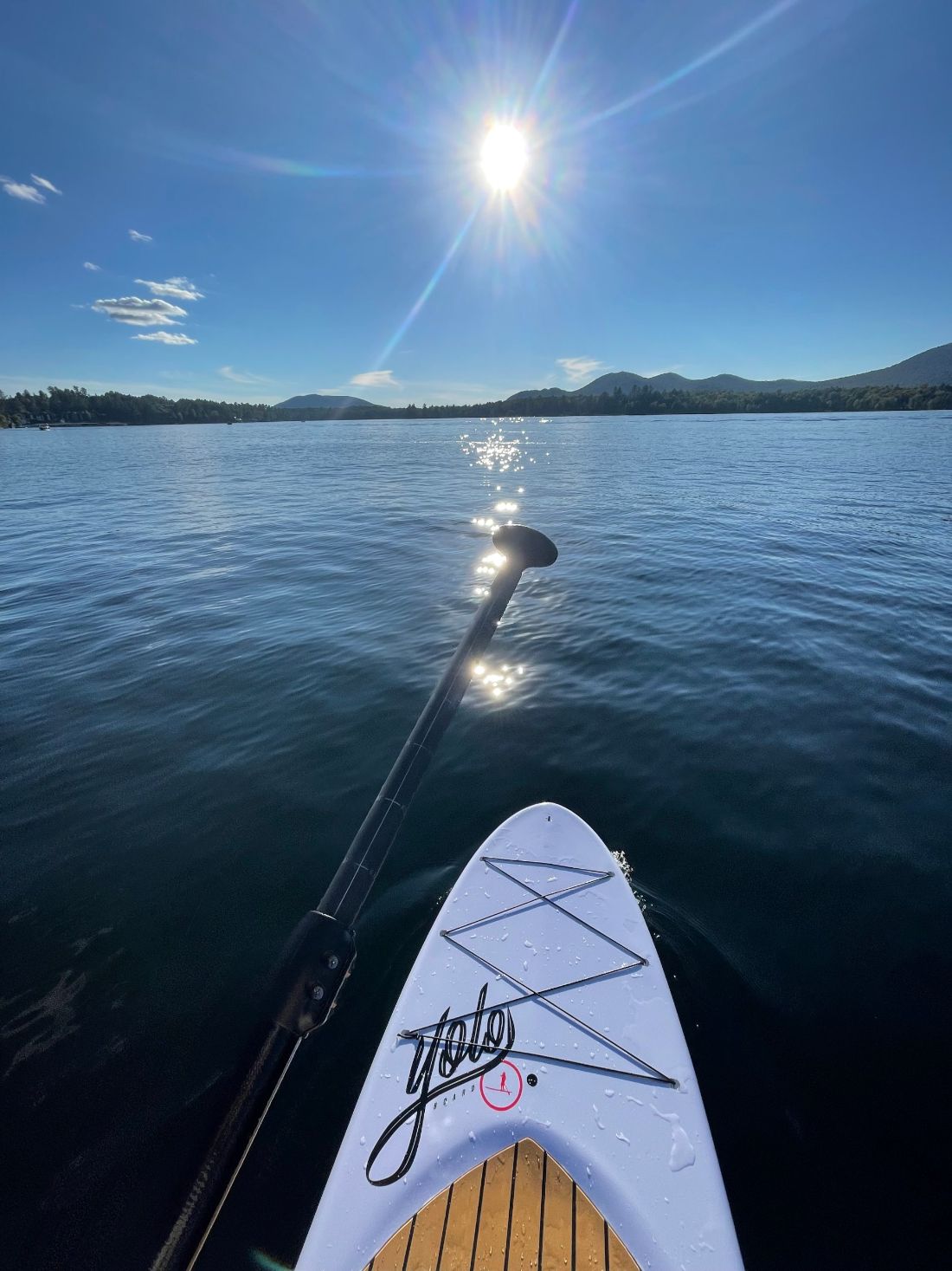 Paddle and board on Lake Placid in afternoon sun