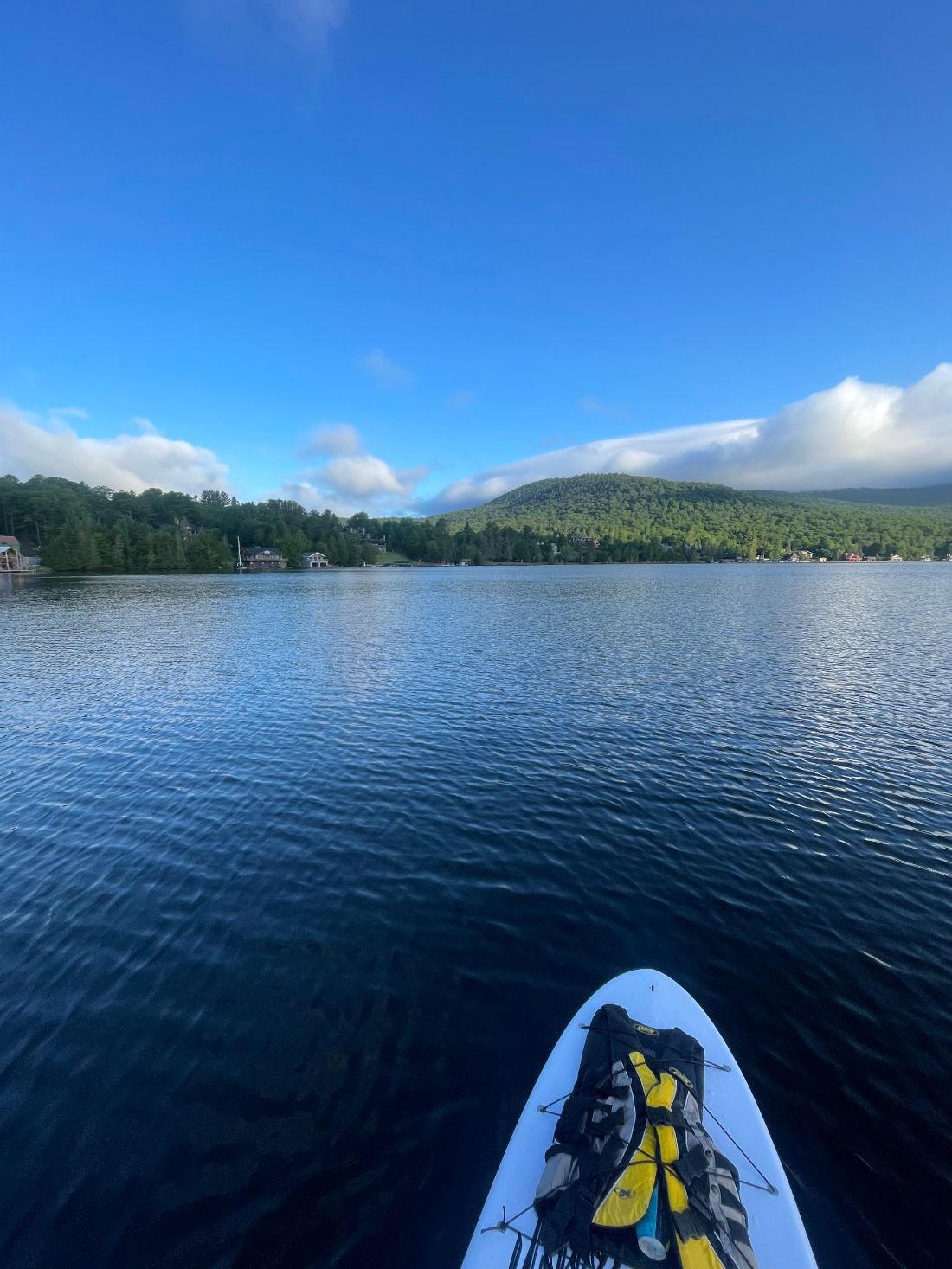 Life vest strapped to the nose of a paddleboard on Lake Placid